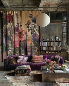 a living room filled with furniture and curtains