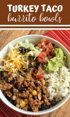 turkey taco burrito bowls in a bowl with rice, beans and guacamole