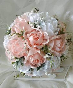 a bridal bouquet with pink and white flowers