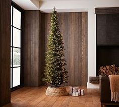 a living room with a christmas tree in the corner