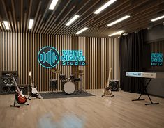 an acoustic studio with guitars, drums and microphones on the floor in front of a sign that reads white nights studios