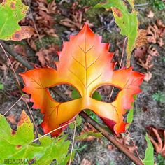 This little leather leaf mask is well suited for a dryad costume or autumn fairy theme. It's a smaller mask that fits nicely on an average adult face. MEASUREMENTS + MATERIALS ✭ Materal: tooling leather, dye, paint, sealant, and quality ribbon ties. ✭ Measures approximately 8.5" wide by 7.5" high at the highest and widest points ✭ Ties with gorgeous and durable stretch ribbon straps (included). The mask is sculpted from fine tooling leather. It's hand carved, and painted in shades of rich fall hues of golden yellow, orange, and rusty red. Some of the photos show this mask beside a similar green version. This listing is for the fiery yellow/orange mask shown alone in the first several photos. The green mask is available in a separate listing, and they'd work nicely together as a thematic pa Fairy Masquerade, Dryad Costume, Leaf Mask, Paint Sealant, Fairy Theme, Face Measurements, Autumn Fairy, Leather Leaf, Leather Mask