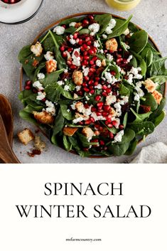 spinach winter salad with pomegranate, feta cheese and croutons