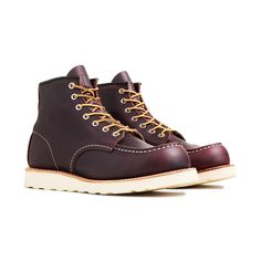 Red Wing's been making their Classic Moc boot for over 70 years. Its staying power is a testament to the shoe's quality and its timeless design. This release has an upper made from full-grain, waxed leather in a Black Cherry Excalibur color that will only improve over time. It's married to the Traction Tred rubber outsole with a Goodyear leather welt, allowing the boots to be resoled as needed. A cork midsole provides comfort while triple stitching and Taslan laces offer added durability, only i Everyday Carry Bag, Wing Boots, Red Wing Boots, Field Watches, Red Wing, Trail Shoes, Dress Watch, Black Cherry, Dive Watches