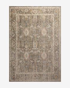 an antique style rug in grey and beige tones