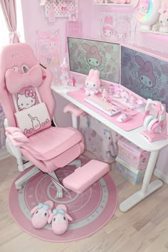 a pink hello kitty desk and chair in a child's room