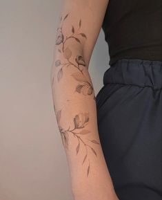 Dainty flower rose tattoo on arm. Flower vine Dainty Vine Tattoo Arm, Delicate Arm Sleeve Tattoo, Delicate Tattoo Sleeve Women, Roses Wrapped Around Arm Tattoo, Forearm Delicate Tattoo Women, Rose Vine Sleeve Tattoo, Line Tattoo With Flowers, Fineline Forearm Tattoo Women, Blossom Wrap Tattoo