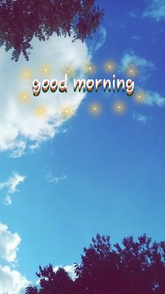 the words good morning are written in front of blue sky with clouds and green trees