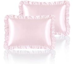 two pink satin pillows with ruffled edges