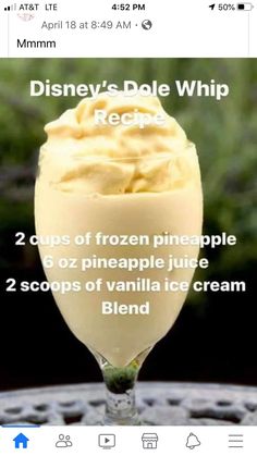 a glass filled with ice cream sitting on top of a table