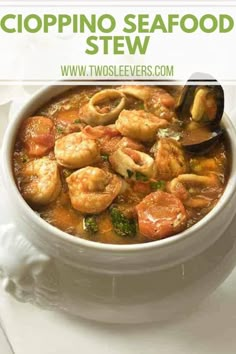 a white bowl filled with shrimp, broccoli and tomato soup on top of a table