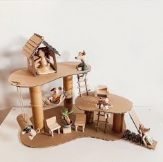 the doll house is made out of cardboard