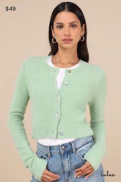 The Lulus Cozy Sweetness Mint Green Eyelash Knit Cropped Cardigan will be your favorite way to layer any look this season! Soft and fuzzy eyelash knit shapes this darling cardigan that features a classic crew neckline and long sleeves. The relaxed-fit bodice features a functional button placket along the center, before ending a trendy cropped hem. Contrasting ribbed knit accents the cuffs and hem. Fit: This garment fits true to size. Length: Size medium measures 17.75" from shoulder to hem. Bust Sage Green Cardigan, Mint Sweater, Mint Green Sweater, Mint Fashion, Green Cardigan, Cropped Cardigan, Sweater Blouse, Fitted Bodice, Button Placket