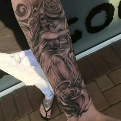 a person's leg with a tattoo on it