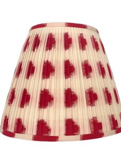 a red and white lampshade with hearts on the bottom, against a white background