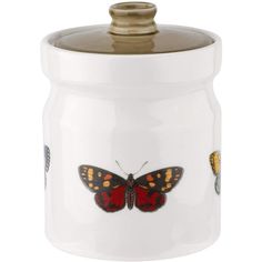 a white jar with a butterfly painted on it