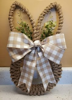 an easter bunny made out of rope with flowers in it