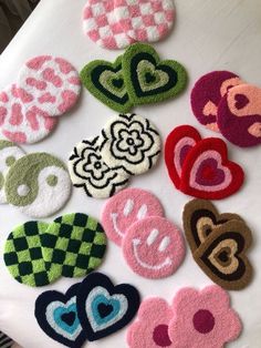 several heart shaped patches are on a table