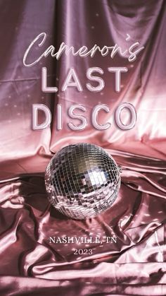 a shiny disco ball sitting on top of a purple satin covered sheet with the words cannon's last disco