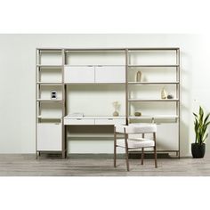 a white desk and chair in front of a bookcase