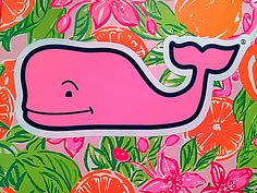 a pink whale surrounded by oranges and flowers