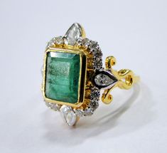 18 K gold Emerald and Diamond set ring. USA ring size-7.5 ( we can adjust size). Size of top-2.2/1.9 cm, weight-7.820 grams, emerald weight-4.36 carats, Diamond weight-1.01 carat. Diamond quality -VS GH Quality. Vintage Gold Emerald Ring With Rose Cut Diamonds, Antique Emerald Cut Yellow Gold Emerald Ring, Art Deco Rectangular Emerald Ring For Anniversary, Art Deco Rectangular Emerald Anniversary Ring, Gold Emerald-cut Emerald Ring With Rose Cut Diamonds, Gold Emerald-cut Ring With Rose Cut Diamonds, Antique Gold Rings With Emerald, Formal Rectangular Hallmarked Emerald Ring, Gold Emerald Ring With Rectangular Stone