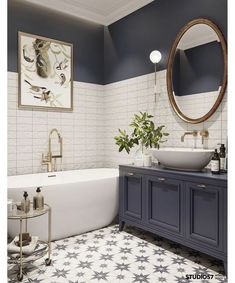 a bathroom with two sinks and a bathtub next to a mirror on the wall