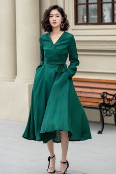 "This elegant green linen dress combines style and comfort. The full, flowy skirt ends just below the knees, adding a timeless charm to the dress. Perfect for a variety of occasions, this dress is a versatile addition to any wardrobe. DETAILS * 100% linen * Two Seam pockets * V-neck collar * No buttons, tie by the string * A Line dress, Wrap dress * Mid-calf length * Perfect for Summer, Spring * Wash by hand or machine with cold water, Ironing after dry Choose CUSTOM Order if you * Need a better Dark Green Long Sleeve Midi Dress For Spring, Dark Green Knee-length Summer Dress, Casual Dark Green Midi Dress For Spring, Spring Knee-length Solid Linen Dress, Green Linen Dress Solid Color, Spring Solid Color Knee-length Linen Dress, Green A-line Solid Color Midi Dress, Spring Green Solid Midi Dress, Dark Green Midi Length Spring Dress