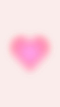 a heart shaped object is shown on a pink and white background with the light reflecting off it's left side