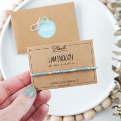 This Morse code bracelet featuring the powerful message "I AM ENOUGH" is the perfect positive affirmation gift for anyone who needs a reminder of their inner strength and self-worth. Discreet yet meaningful, this bracelet carries a hidden message of self-love and empowerment that encourages you to embrace your true self every day. More than just jewelry, this bracelet is a motivational symbol of self-worth. It's the ideal way to offer support and encouragement to someone struggling with self-est Code Morse, Self Love Quote, Dash And Dot, Coded Message, Cheer Up Gifts, Message Bracelet, Hidden Message, Morse Code Bracelet, I Am Enough