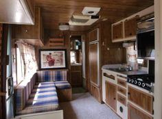 the interior of an rv is clean and ready to be used as a kitchen area