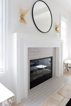 a white fireplace with a mirror above it and the caption reads this home is the epitone of california cool