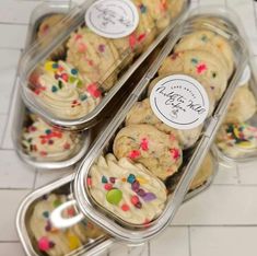 three tins filled with cookies and sprinkles