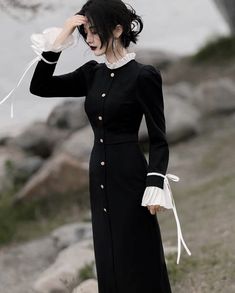 Unleash your vampy side with our Vamp Lady Black Witchy Dark Academia dress. With its elegant pleated white cuffs and collar, accented by luxe gold buttons, this sophisticated dress brings an air of aristocratic grace. Crafted from a very stretchy fabric, this midi-length piece is perfect for any dark witchy mood. ☾ Fulfil your witchy Victorian princess fantasies with our WITCHY ACADEMIA collection featuring dark, gothic and romantic vintage-inspired magic & mystery dresses ☽ Size: S Bust: 82-88 Witchy Dark Academia, Dark Academia Dress, Academia Dress, Goth Academia, Victorian Princess, Witchy Academia, Dark Dress, Dark Feminine Aesthetic, Dress Aesthetic