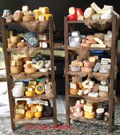 two wooden shelves filled with different types of cheese