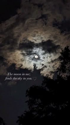 the moon is in the sky with trees below it and an inspirational quote on top