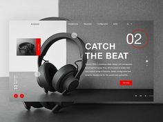 an image of headphones on display in front of a website page that says catch the beat