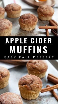 apple cider muffins on a baking sheet with cinnamon sticks in the background