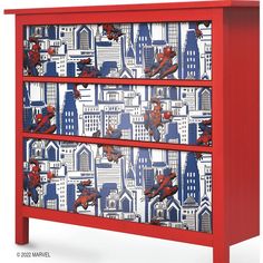 a red dresser with spiderman decals on the front and bottom drawers in blue, white, and red