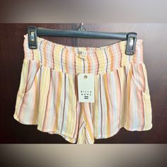 Nwt Billabong Women’s Short In Size L. Comfortable And Lightweight, These Mid-Rise Shorts Have A Flattering Smocked Waistband. Two Front Pockets And 2 Back Pockets, They Are Versatile And Functional During Hot Beach Days. Vertical Stripes In Yellow, Light Blue, Peach, And Browns. Cheap Orange Beachwear Shorts, Preppy Summer Fits, Outfit Inspo Board, Billabong Shorts, Hot Beach, Billabong Women, Shorts Outfits, Mid Rise Shorts, Preppy Summer