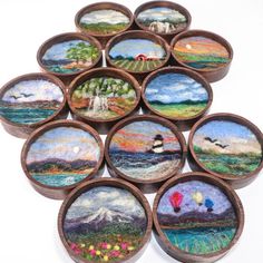 a group of wooden bowls filled with different pictures