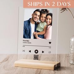 a wooden stand with a photo on it and the words ships in 2 days above it