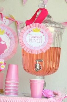 pink party supplies and decorations for a princess birthday