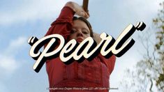 a woman holding a baseball bat over her head with the word pearl in front of her