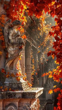 the statue is surrounded by autumn leaves