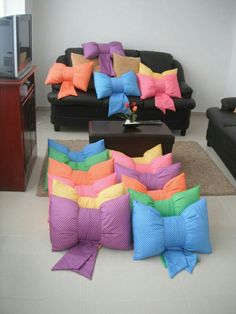 a living room filled with lots of colorful pillows