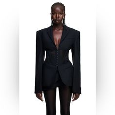 New With Tag Size Xxl Mugler H&M. Sharp-Tailored, Single-Breasted Jacket In Wool Twill With Bold Shoulder Pads That Create A Defined Silhouette. The Blazer Comes With The Classic Corset Detail In Mesh With Sewn-In Boning And Concealed Hook-And-Eye Fasteners. Pointed Collar, Notch Lapels And Extra-Long Sleeves With Buttoned Cuffs. Angled Chest Pocket, Jetted Front Pockets And A Single Back Vent. Partly Lined. Mugler X H&M Collaboration! Extremely Limited And Sold Out Worldwide! Black Colourway Co Corset Blazer, Corset Outfit, Extra Long Sleeves, Single Breasted Jacket, Blazer Outfits, Corset Style, Catsuit, Wool Jacket, Black Wool