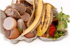 an egg carton filled with different types of food including bananas, eggs and other foods