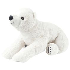 a white stuffed polar bear laying down