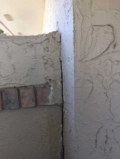 the corner of a wall with some paint on it